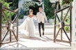 Bride Wearing Aline Wedding Dress Called Nerida By Sottero And Midgley Walking Hand In Hand With Groom