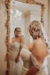 Bride wearing Danielle by Maggie Sottero looking in the mirror