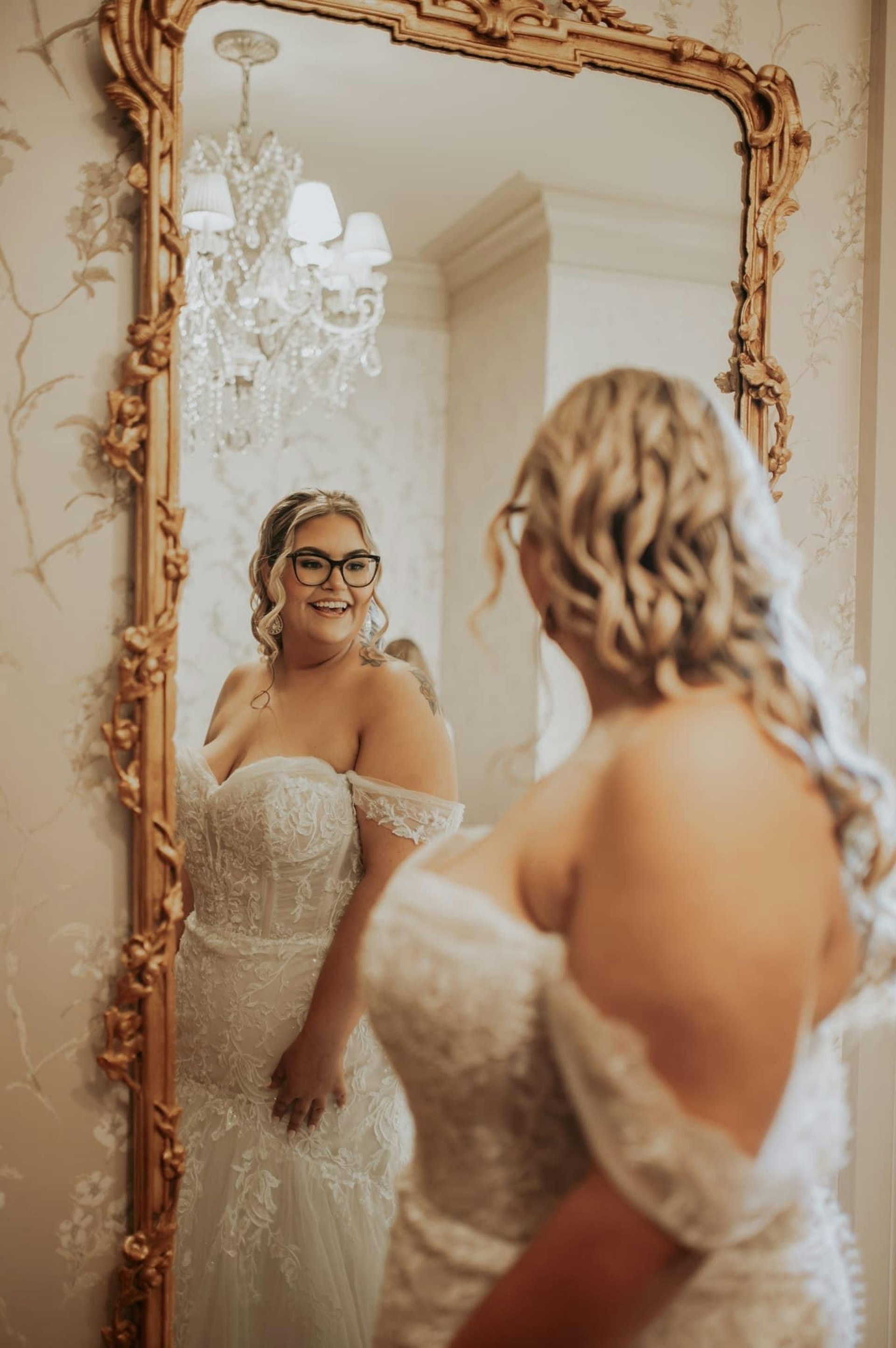 Bride wearing Danielle by Maggie Sottero looking in the mirror