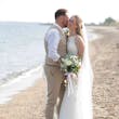 Bride wearing Davis Leigh wedding dress by Sottero and Midgley being kissed by her husband