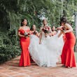 Bride with bridesmaids wearing glamorous mermaid wedding dress