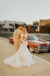 Groom With Bride Wearing Ethereal Beaded Mermaid Bridal Dress Geddes By Maggie Sottero 