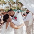 Bride wearing Johanna Lane by Maggie Sottero kissing her husband after their cermeony