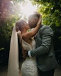 Bride wearing Fontaine by Maggie Sottero kissing her husband