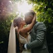 Bride wearing Fontaine by Maggie Sottero kissing her husband