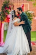 Bride wearing Anniston Marie by Maggie Sottero kissing her husband