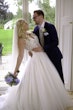 Bride In Lace A-Line Wedding Dress Called Taylor By Maggie Sottero With Long Veil And Groom