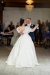 Bride wearing Derrick by Maggie Sottero dancing with a loved one