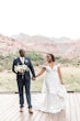 Bride with groom wearing off the shoulder lace wedding dress