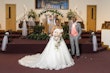 Groom With Bride Wearing White Lace Ball Gown