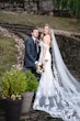 Groom With Bride Wearing Lace Sheath Wedding Dress Tanica By Sottero And Midgley