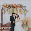 Groom with Bride at Cowboy Themed Wedding Wearing Dress Called Priscilla by Rebecca Ingram