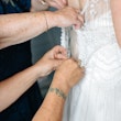 Bride Wearing Ivory Satin Sheath Wedding Dress Ettia By Maggie Sottero