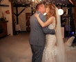Bride Wearing Fit-and-Flare Wedding Dress Called Wendi By Rebecca Ingram Kissing Groom With Bubble Behind Them
