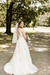 Bride wearing affordable floral ballgown wedding dress.