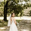 Bride wearing affordable floral ballgown wedding dress.