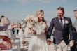 Bride Wearing Off-The-Shoulder Lace Wedding Dress Called Carson By Sottero And Midgley With Groom After The Ceremony