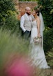 Bride wearing Lorraine by Rebecca Ingram with her husband