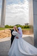 Bride wearing Juniper by Sottero and Midgley with her husband