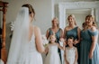 Bride wearing Lorraine by Rebecca Ingram doing a first look with her bridesmaids and flower girls