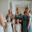 Bride wearing Lorraine by Rebecca Ingram doing a first look with her bridesmaids and flower girls