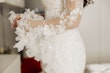 Bride wearing Ryker wedding dress by Sottero and Midgley showing off sleeve detail