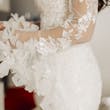 Bride wearing Ryker wedding dress by Sottero and Midgley showing off sleeve detail