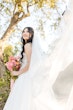 Bride wearing Casey by Maggie Sottero with a veil