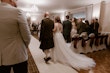 Real Bride in Nature-Inspired Tulle Wedding Dress with Plunging V-Neckline Called Jenessa by Rebecca Ingram