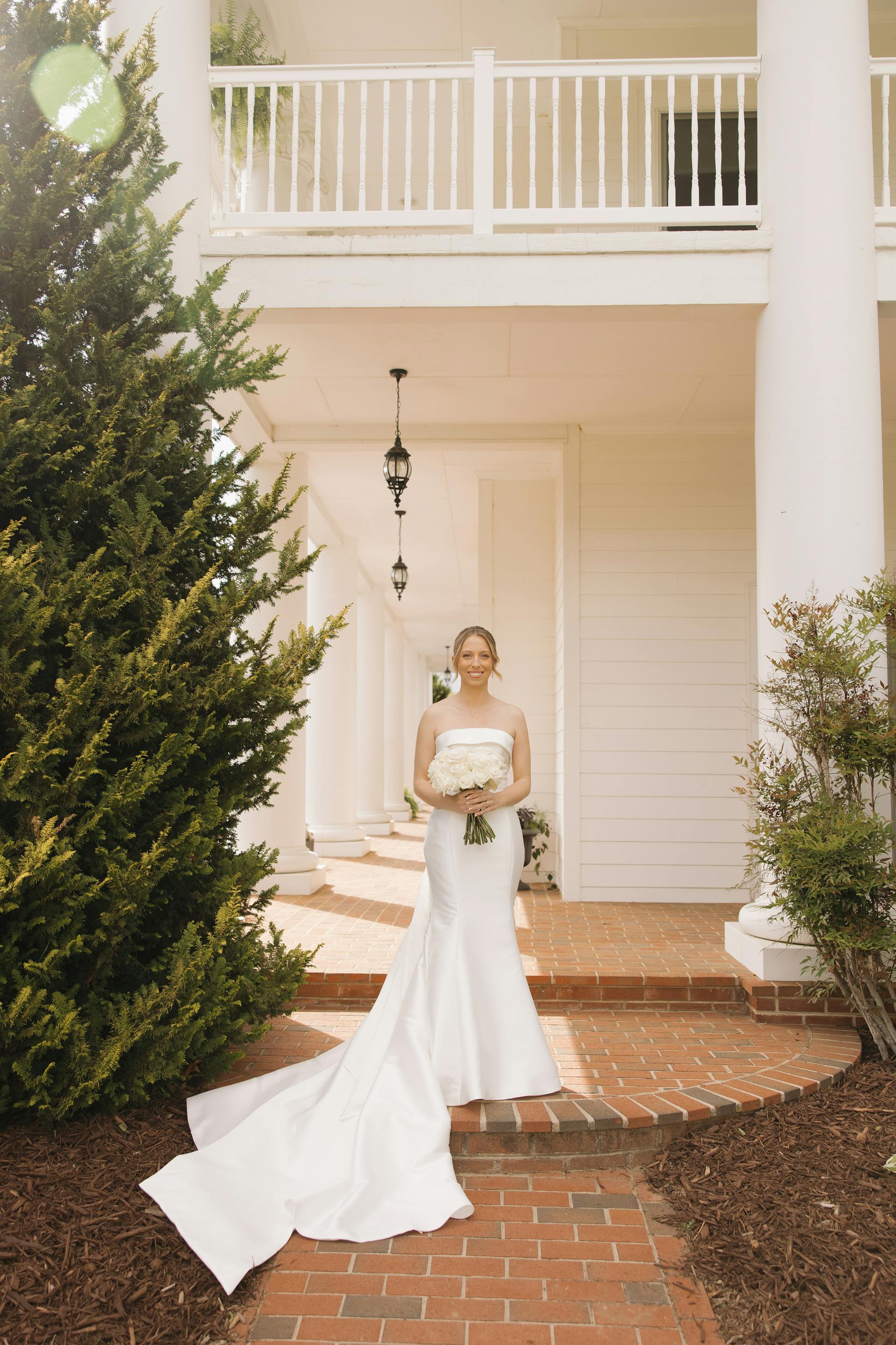 Bride Wearing Simple Mermaid Wedding Dress Called Mitchell By Maggie Sottero Next To A Pine Tree