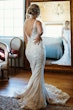 Bride wearing Albany wedding dress by Maggie Sottero looking in the miror