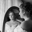 Bride Wearing Chiffon A-Line Wedding Dress Called Heather By Rebecca Ingram Getting Ready