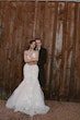 Bride wearing Bridget by Maggie Sottero cuddled up with her husband