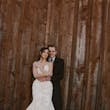 Bride wearing Bridget by Maggie Sottero cuddled up with her husband