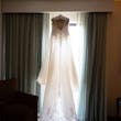 Savannah Wedding Dress by Maggie Sottero Hanging in Window.