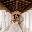 Bride with groom wearing strapless tulle ballgown wedding dress