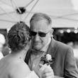 Bride Wearing Chiffon A-Line Wedding Dress Called Heather By Rebecca Ingram Dancing With Her Grandpa