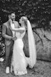 Bride wearing Fontaine by Maggie Sottero embracing her husband