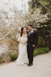 Bride wearing Clover by Rebecca Ingram with her husband