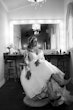 Bride In Off The Shoulder Lace Wedding Dress Called Tiffany By Maggie Sottero In Cowboy Boots