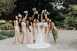 Bride Wearing A-Line Romantic Wedding Dress Called Marlow By Sottero And Midgley Holding Bouquets With Bridesmaids
