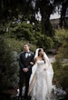 Bride wearing Barcelona by Sottero and Midgley with her husband outside