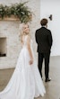 First Look With Bride Wearing Plunging Lace Illusion Wedding Dress Called Raelynn By Rebecca Ingram