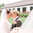 Bride wearing Johanna by Maggie Sottero touching foreheads with her partner