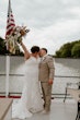 Bride wearing Tuscany Marie wedding dress by Maggie Sottero kissing her husband