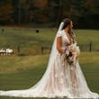 Bride wearing Kingsley wedding gown by Sottero and Midgley