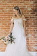 Bride Wearing Lace Aline Bridal Gown Called Harlem By Maggie Sottero Holding Pastel Bouquet