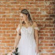Bride Wearing Lace Aline Bridal Gown Called Harlem By Maggie Sottero Holding Pastel Bouquet