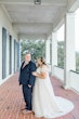 Groom with Bride Wearing A-Line Wedding Dress Called Wallis by Maggie Sottero