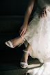 Bride Wearing Nature Lace Wedding Dress Called Albany By Maggie Sottero Putting On Her Shoes